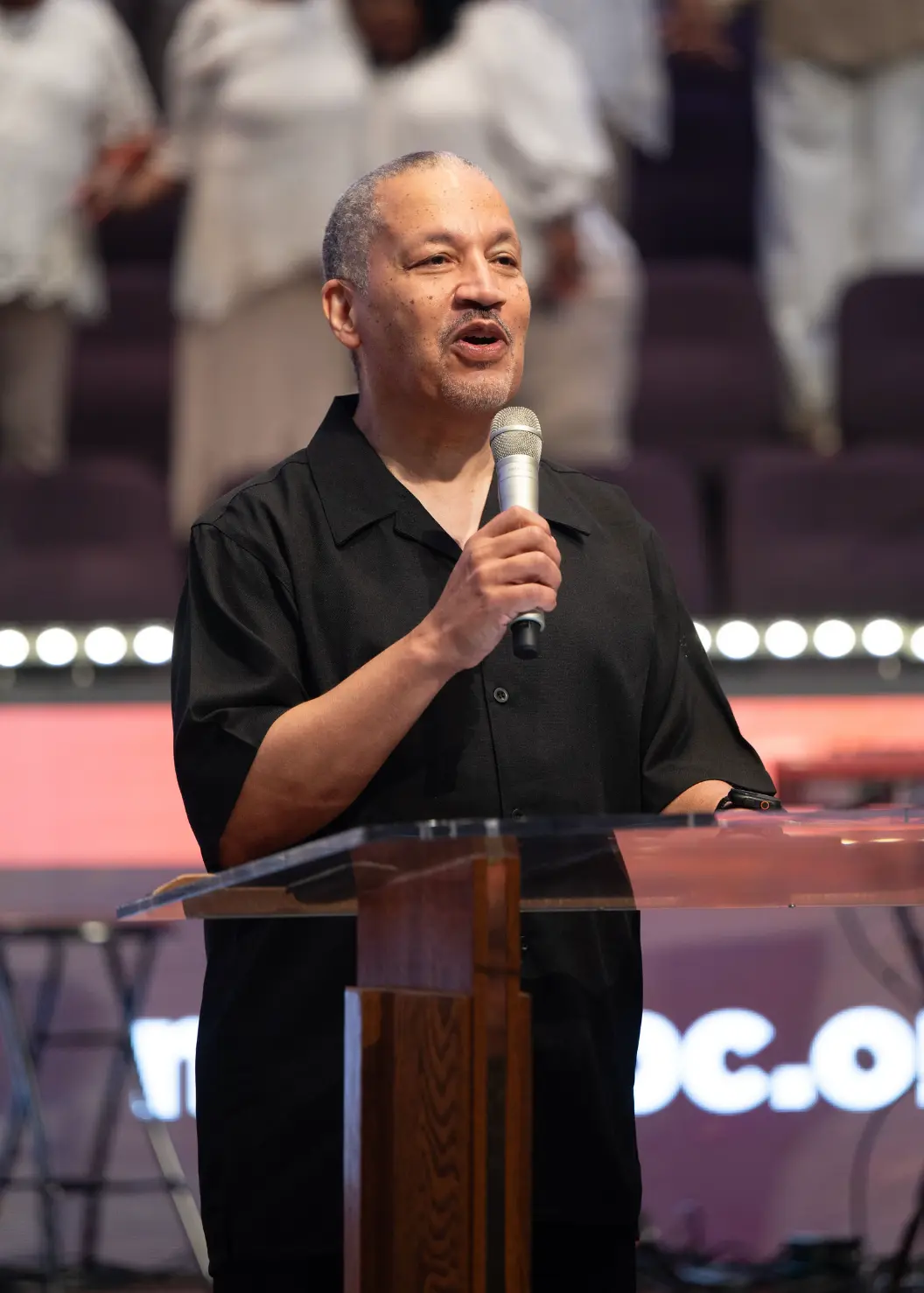 Dr. Lance D. Watson speaking at the pulpit